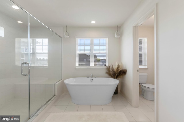 full bath with toilet, tile patterned floors, recessed lighting, a soaking tub, and a stall shower