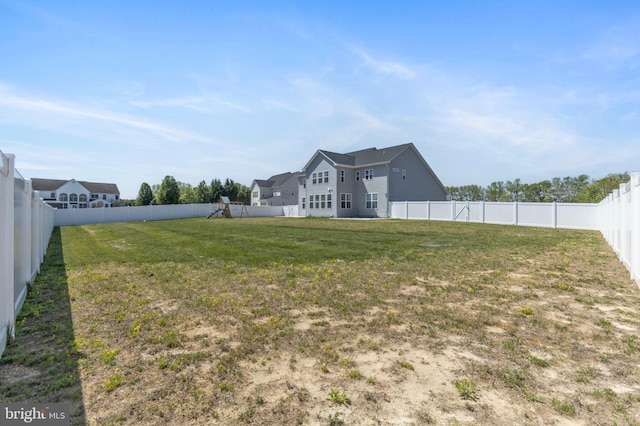 view of yard with a fenced backyard