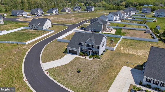 birds eye view of property with a residential view