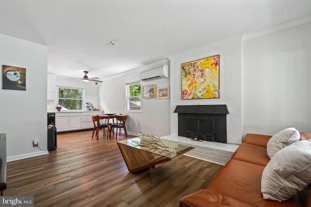 1826 Hylton Ave, Woodbridge, VA 22191 - living area featuring a wall mounted AC, crown molding, wood finished floors, ceiling fan, and a fireplace