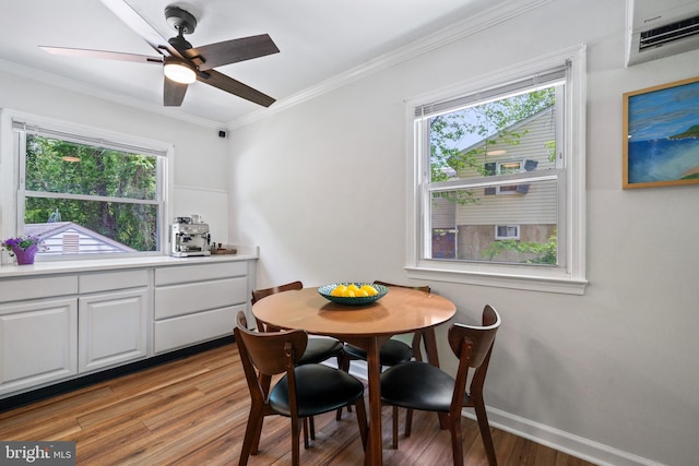 1826 Hylton Ave, Woodbridge, VA 22191 - dining room with a wall mounted AC, healthy amount of natural light, light wood-type flooring, ornamental molding, and a ceiling fan