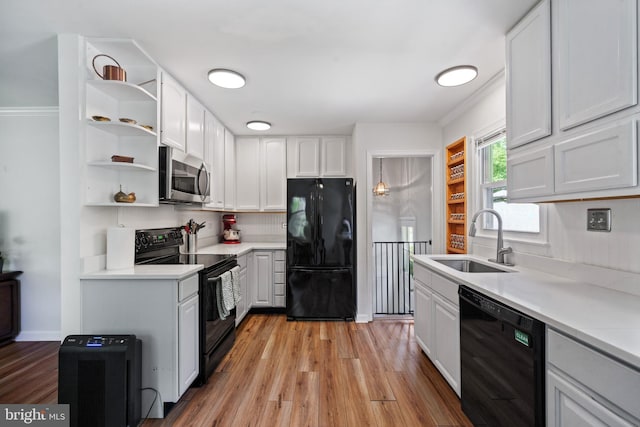 1826 Hylton Ave, Woodbridge, VA 22191 - kitchen with black appliances, a sink, open shelves, and light wood finished floors
