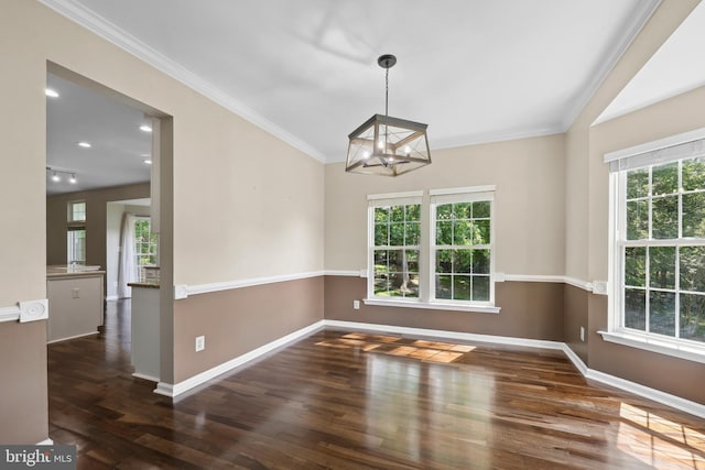 7883 Leroux Ln, Manassas, VA 20112 - unfurnished dining area with wood finished floors, a chandelier, baseboards, and crown molding