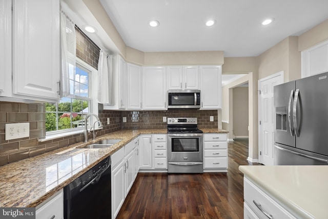 7883 Leroux Ln, Manassas, VA 20112 - kitchen with stainless steel appliances, a sink, dark wood-type flooring, white cabinets, and recessed lighting