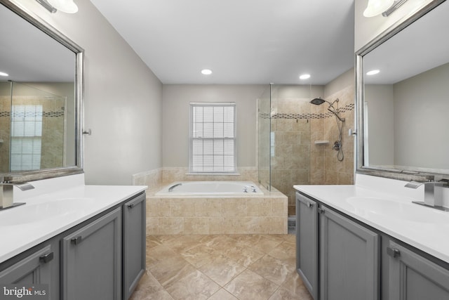 7883 Leroux Ln, Manassas, VA 20112 - full bathroom featuring a stall shower, a bath, two vanities, recessed lighting, and tile patterned flooring
