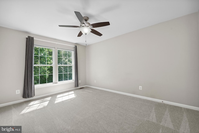 7883 Leroux Ln, Manassas, VA 20112 - empty room with ceiling fan, carpet flooring, and baseboards