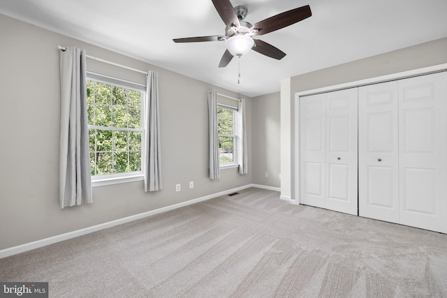 7883 Leroux Ln, Manassas, VA 20112 - unfurnished bedroom with baseboards, carpet floors, a closet, and ceiling fan