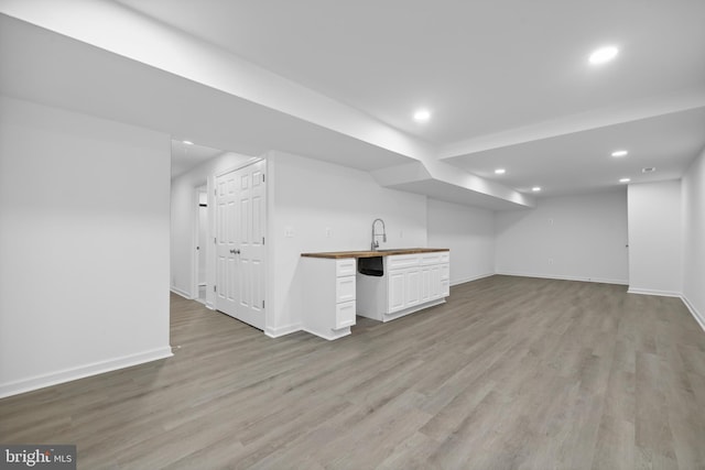 7883 Leroux Ln, Manassas, VA 20112 - finished basement with recessed lighting, baseboards, light wood-style floors, and wet bar