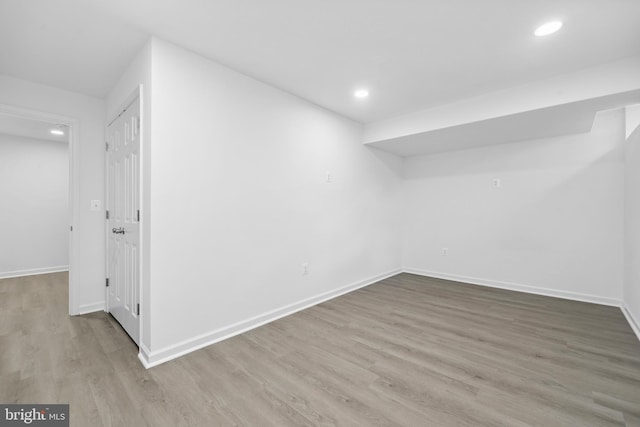 7883 Leroux Ln, Manassas, VA 20112 - finished below grade area featuring wood finished floors, baseboards, and recessed lighting