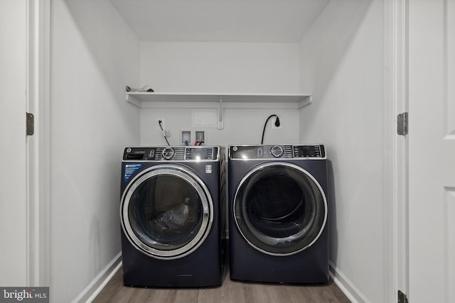 7883 Leroux Ln, Manassas, VA 20112 - laundry room featuring washing machine and dryer, wood finished floors, and baseboards