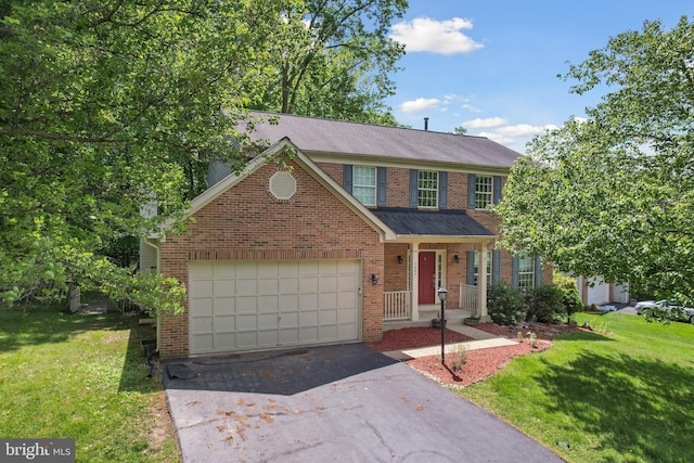 7883 Leroux Ln, Manassas, VA 20112 - traditional home featuring asphalt driveway, a front yard, and brick siding
