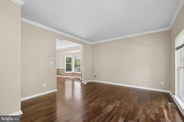 7883 Leroux Ln, Manassas, VA 20112 - spare room with dark wood-type flooring, baseboards, and crown molding