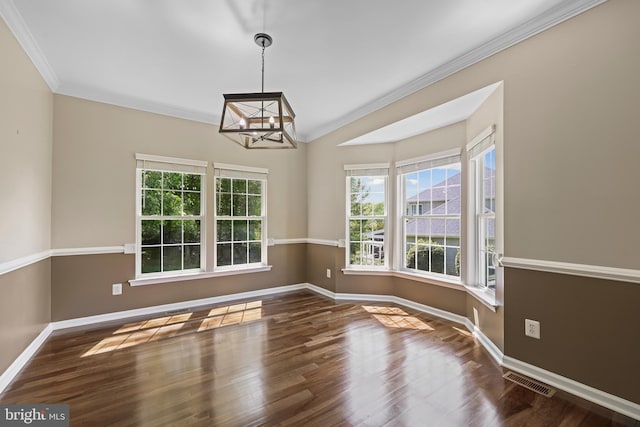 7883 Leroux Ln, Manassas, VA 20112 - unfurnished dining area featuring a chandelier, wood finished floors, baseboards, ornamental molding, and lofted ceiling