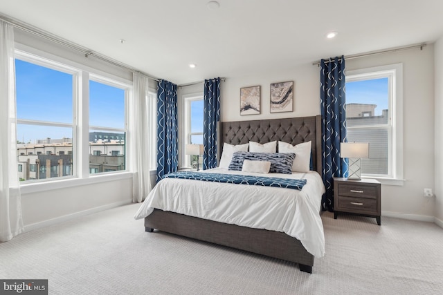 bedroom with baseboards, recessed lighting, and carpet floors