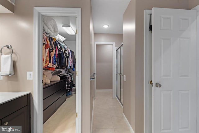 3565 Hummock Pl, Woodbridge, VA 22192 - walk in closet featuring light tile patterned flooring