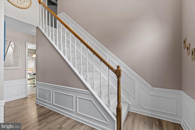 3565 Hummock Pl, Woodbridge, VA 22192 - stairway with a decorative wall, a wainscoted wall, and wood finished floors