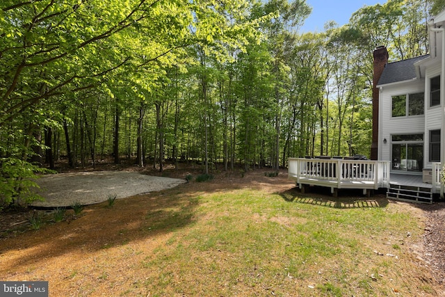 view of yard featuring a wooden deck
