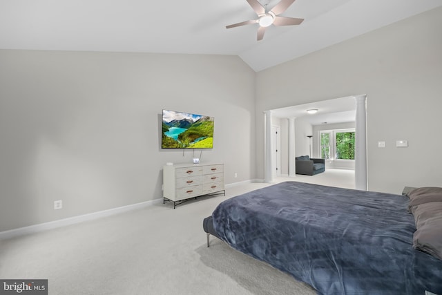 bedroom with ceiling fan, baseboards, high vaulted ceiling, carpet, and ornate columns