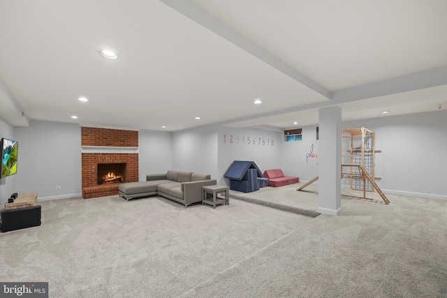 living area with carpet floors, baseboards, a brick fireplace, and recessed lighting