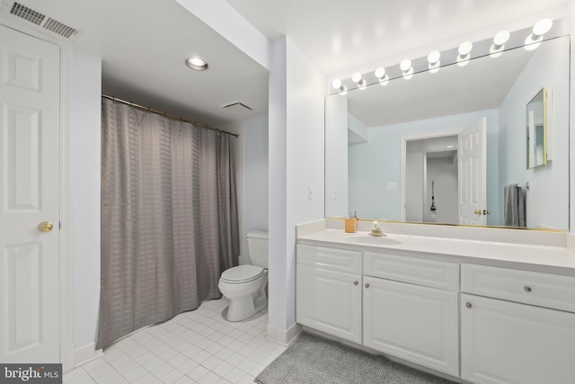 full bath with visible vents, tile patterned flooring, vanity, toilet, and baseboards