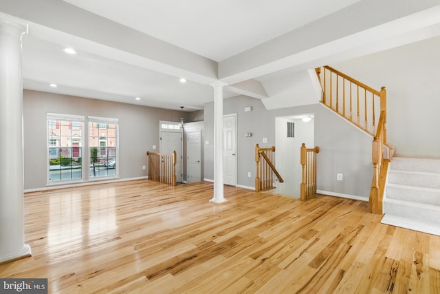 13014 Prairie Knoll Ct, Germantown, MD 20874 - unfurnished living room with light wood-style flooring, baseboards, visible vents, recessed lighting, and ornate columns