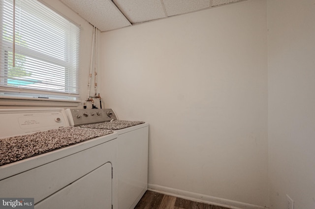 washroom with baseboards, laundry area, dark wood finished floors, and washer and clothes dryer