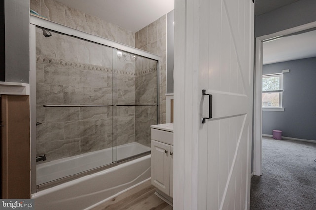 full bathroom featuring combined bath / shower with glass door