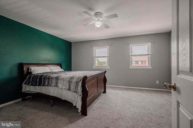 bedroom featuring baseboards, carpet flooring, and ceiling fan