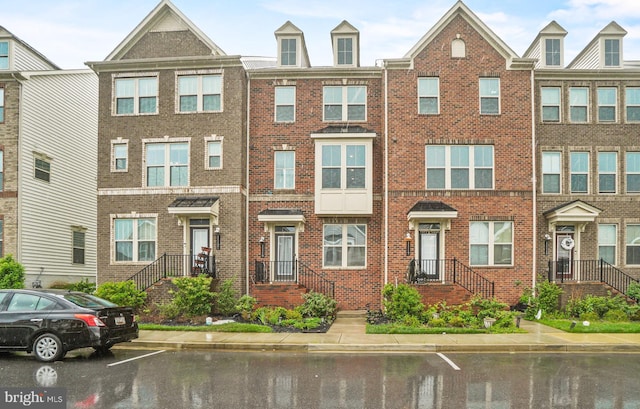 11119 Hazelnut Ln, Monrovia, MD 21770 - view of property with brick siding and uncovered parking