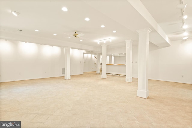 finished below grade area with baseboards, ceiling fan, recessed lighting, and track lighting