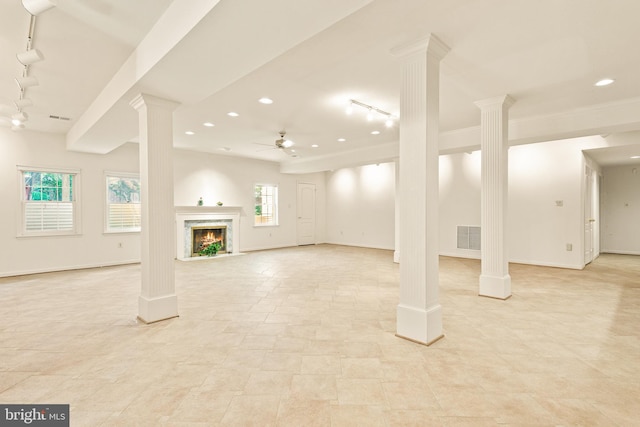 basement with recessed lighting, a ceiling fan, track lighting, and visible vents