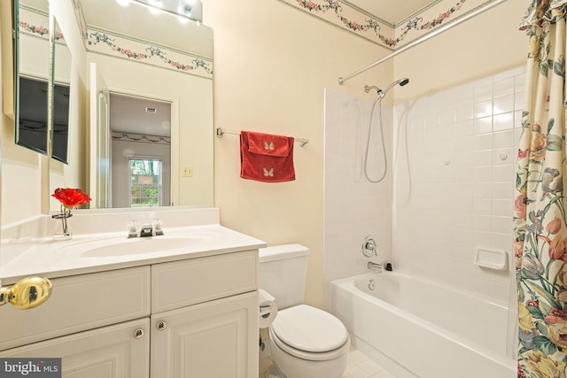 bathroom featuring toilet, shower / tub combo, and vanity
