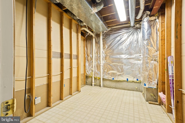 unfinished basement with tile patterned floors