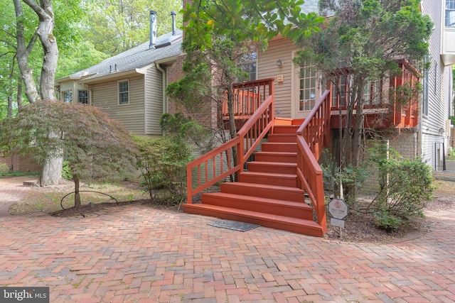 exterior space featuring stairway and a deck
