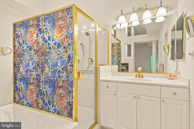 bathroom featuring vanity, decorative columns, and a stall shower