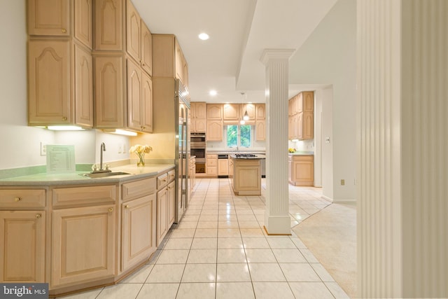 kitchen with recessed lighting, a sink, light tile patterned flooring, and light brown cabinets