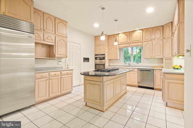 kitchen featuring light brown cabinetry, appliances with stainless steel finishes, a center island, and light tile patterned flooring