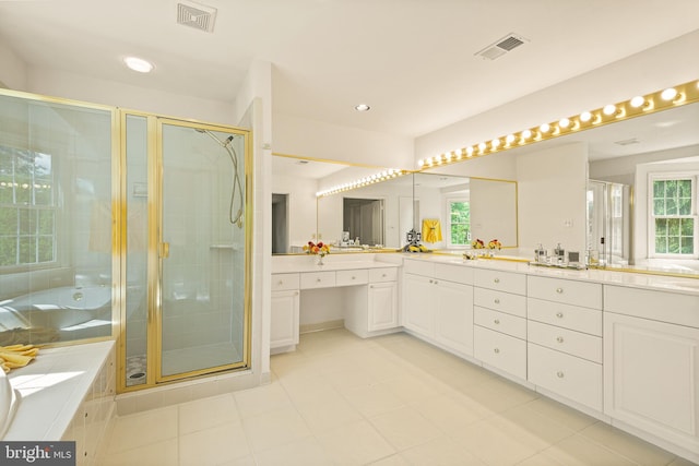 bathroom with a shower stall, vanity, visible vents, and a bath