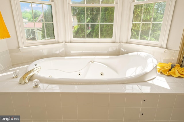 full bathroom with a whirlpool tub