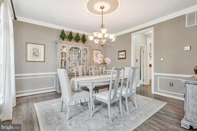 2840 Dunleigh Dr, Dunkirk, MD 20754 - dining area with a chandelier, dark wood-style floors, ornamental molding, and visible vents