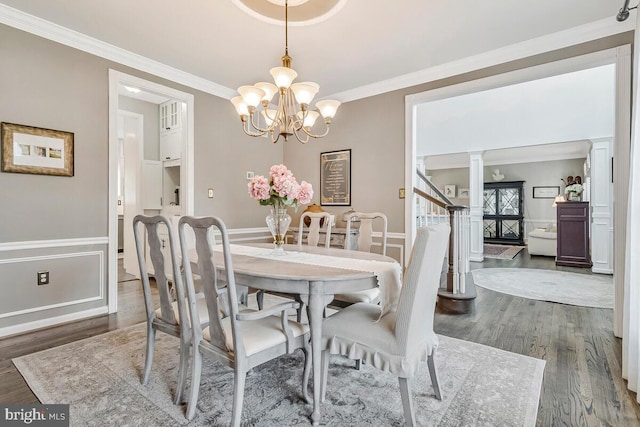 2840 Dunleigh Dr, Dunkirk, MD 20754 - dining space with crown molding, wood finished floors, and a chandelier