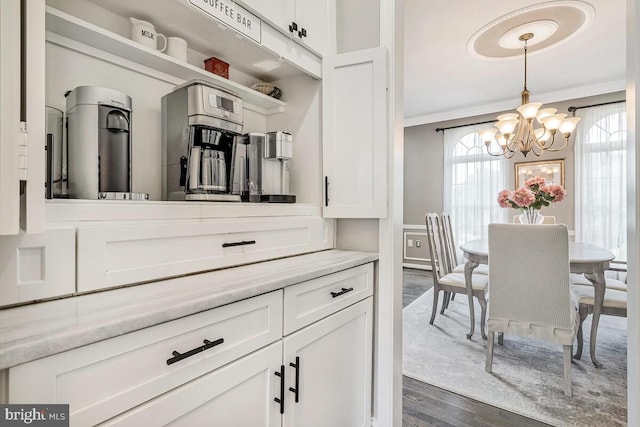 2840 Dunleigh Dr, Dunkirk, MD 20754 - interior space with crown molding, a chandelier, and dark wood finished floors