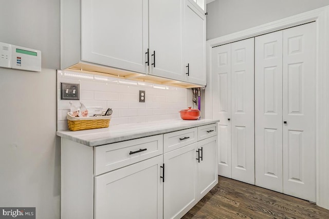 2840 Dunleigh Dr, Dunkirk, MD 20754 - bar with backsplash and dark wood-type flooring