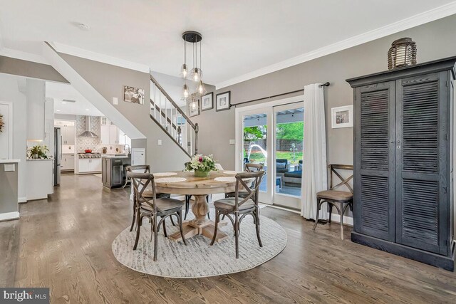 2840 Dunleigh Dr, Dunkirk, MD 20754 - dining area with baseboards, ornamental molding, stairs, and wood finished floors