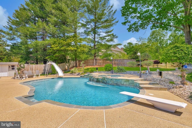2840 Dunleigh Dr, Dunkirk, MD 20754 - view of swimming pool featuring a patio, a fenced backyard, a diving board, an in ground hot tub, and a water slide