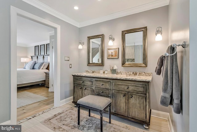 2840 Dunleigh Dr, Dunkirk, MD 20754 - bathroom with ornamental molding, double vanity, wood finished floors, baseboards, and recessed lighting