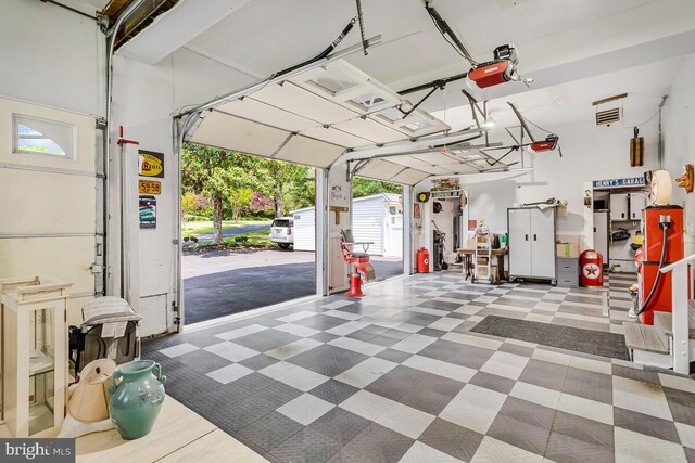 2840 Dunleigh Dr, Dunkirk, MD 20754 - garage with visible vents and a garage door opener