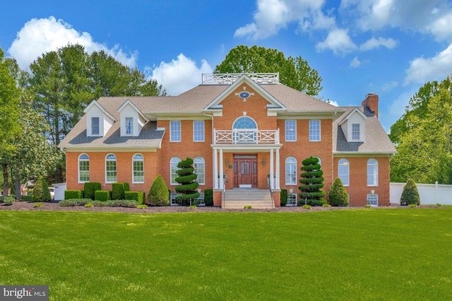 2840 Dunleigh Dr, Dunkirk, MD 20754 - colonial inspired home with fence, a chimney, a front yard, and brick siding