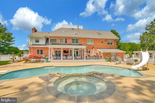 2840 Dunleigh Dr, Dunkirk, MD 20754 - view of pool with fence, a patio, an outdoor hangout area, a diving board, and a water slide