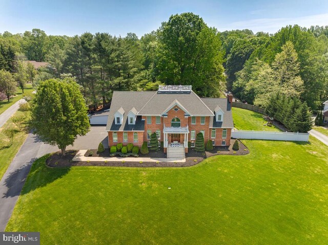 2840 Dunleigh Dr, Dunkirk, MD 20754 - view of front of home featuring brick siding, a front lawn, and a wooded view